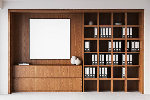istock Blank framed poster mockup on wooden office wall with organized shelves. 3D Rendering 2208807962
