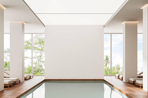istock Modern interior with blank wall for design mockup in luxury poolside space. 3D Rendering 2208808397