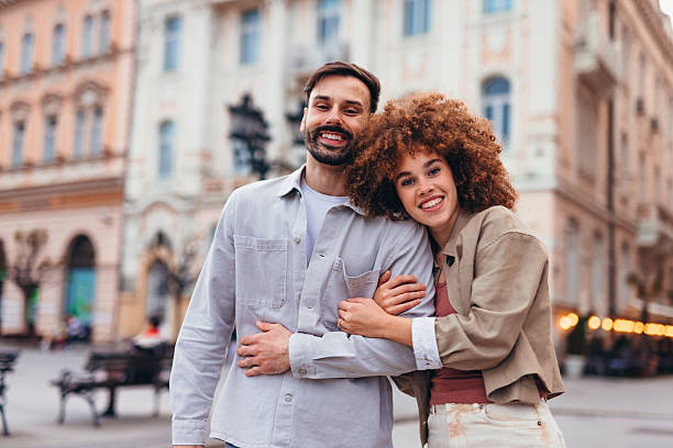 istock Happy couple embracing in a city square 2208810651
