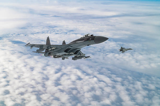istock Air Force Fighter Jets flying over clouds. High Above The Clouds. 2208810844