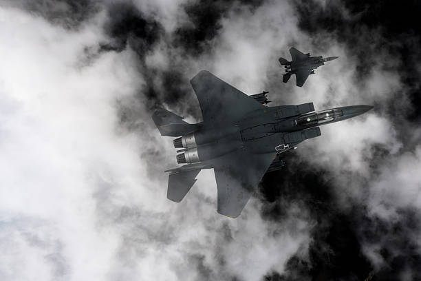istock Air Force Fighter Jets flying over clouds. High Above The Clouds. 2208812110