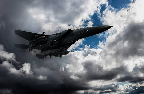 istock Air Force Fighter Jets flying over clouds. High Above The Clouds. 2208813714