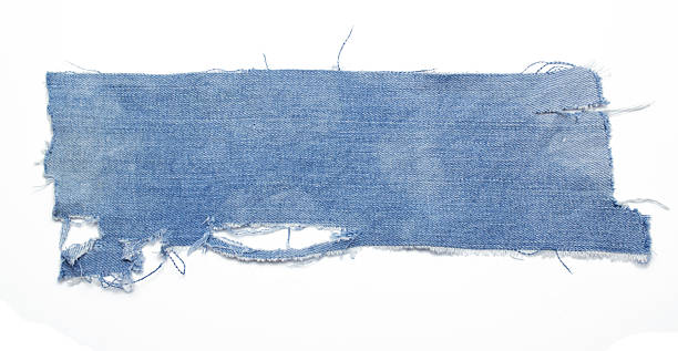 istock jeans. a frayed and torn piece of denim rag 2208822083