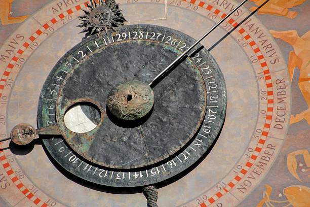 Venice, Veneto, Italy: Catholic Church of the Holy Apostles of Christ (Chiesa dei Santi Apostoli di Cristo), detail of the 17th-century campanile with a 24 hour clock face with golden hands and a golden sun at the center. Cannaregio district.