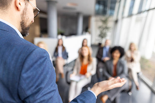 istock Engaged Audience Applauding in a Business Setting 2208827175
