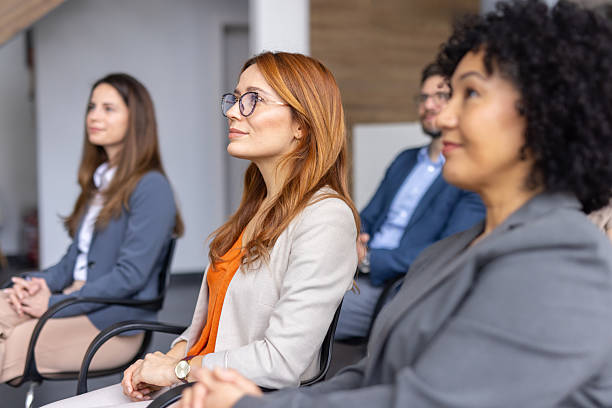 istock Attentive Audience Reflecting in a Classy Office Space 2208827204