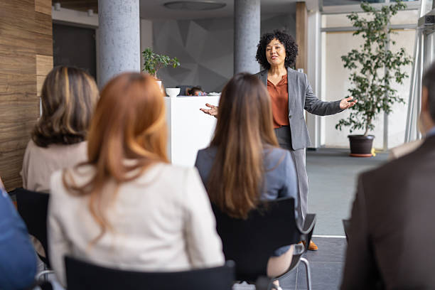 istock Charismatic Speaker Delivering Ideas to an Audience 2208827220