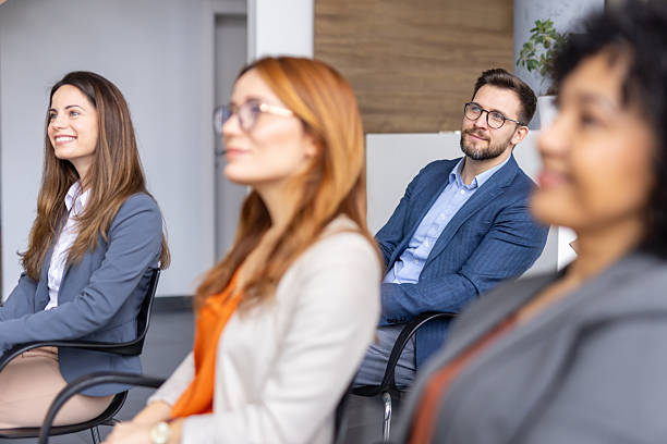 istock Professional Audience at Business Event in Bright Setting 2208827242