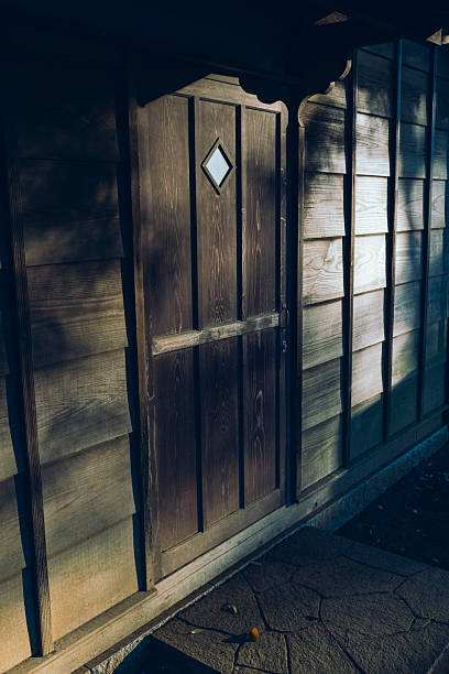 An old-style door with diamond-shaped windows.