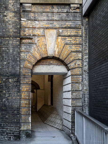 istock A mysterious, grimy and hidden old back alley in London 2208830241