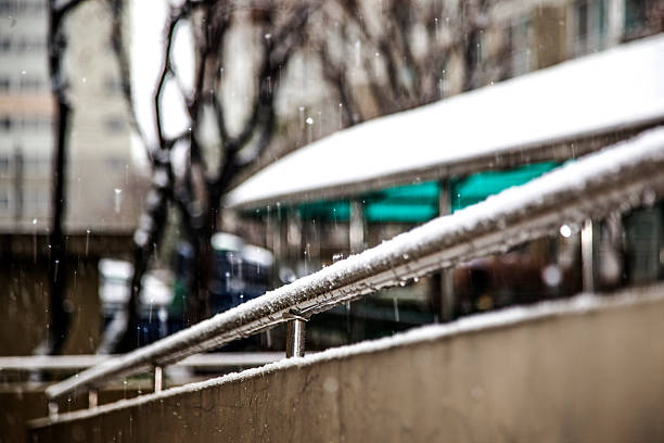 istock guardrail at the apartment on a snowy day 2208836741