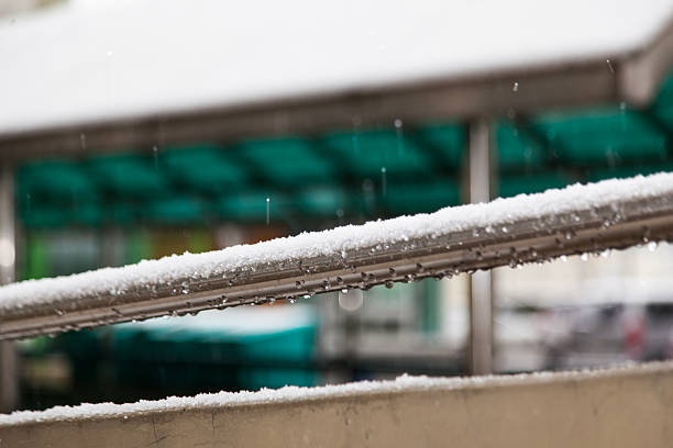 istock guardrail at the apartment on a snowy day 2208836756