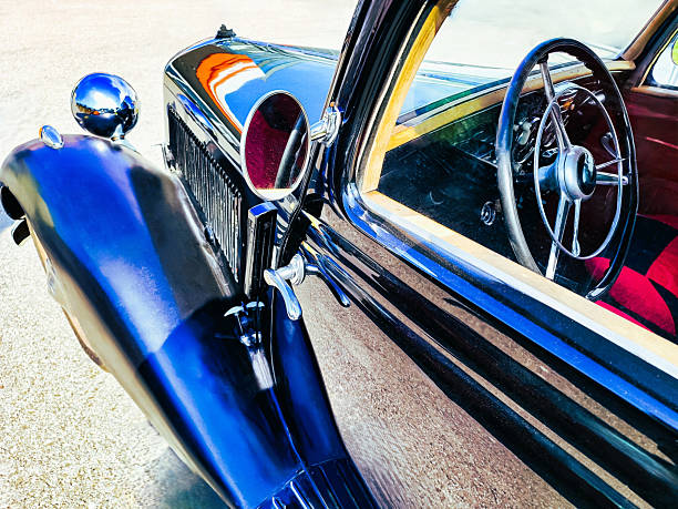 Classic car spotted in an urban setting, showcasing its timeless design under daylight. The scene features nostalgic elements and a relaxed atmosphere, emphasizing retro-inspired style and the allure of vintage vehicles.
