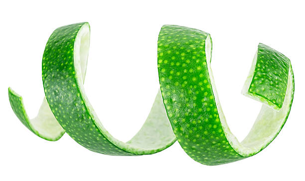 istock Twisting lime peel isolated on a white background. Lime peel slice. Fresh lime twist. 2208840082