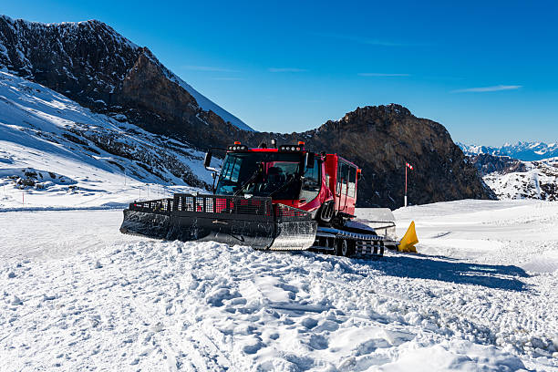 istock snowcat grooming ski slope in Austria 2208841303