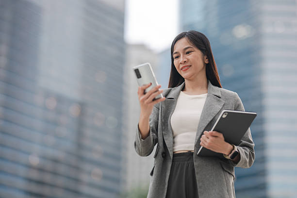 istock An Executive Woman’s Confident Stroll Through the City, Connected by Technology 2208843483