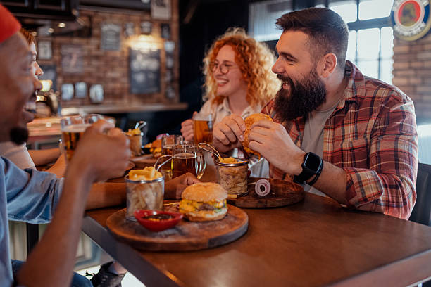 istock Authentic Pub Vibes: Friends Bonding Over Good Times and Great Drinks 2208843819