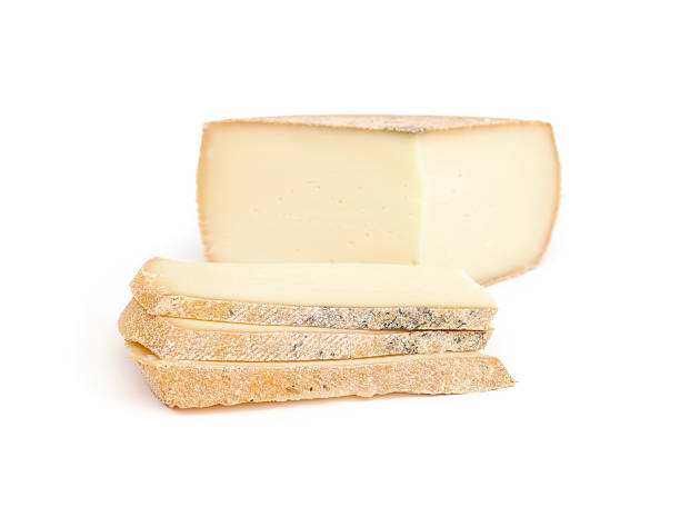 istock Raclette slices with cheese wheel. 2208843947