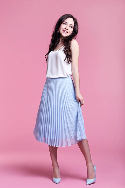 istock Beautiful young woman on pink background 2208845579