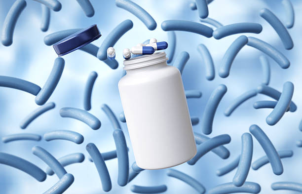 istock Probiotic cells with open bottle and pills. Human microbiome concept 2208846678