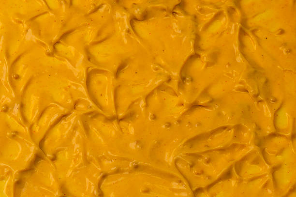 istock Yellow sauce splashes as a background. 2208851860