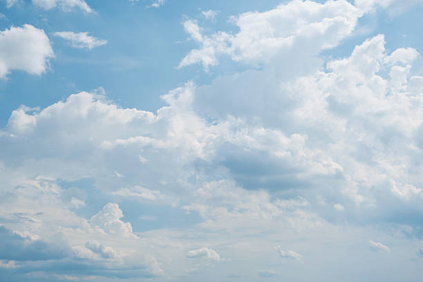 istock Sky. Blue sky with white clouds background. Curly clouds on a sunny summer day. Light cloudy. Good weather. Simple background sky for summer poster. Summer mock up. Soft focus. 2208852977