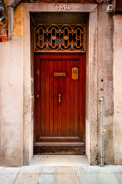 istock Beautiful old antique door on a Gothic brick building. 2208855031