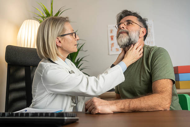 istock Doctor examining patient's throat 2208856504