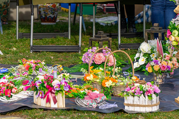 istock richly decorated Easter baskets displayed on the grass during a holiday fair. The baskets are decorated with flowers, ribbons and greenery, creating a colorful, spring composition. 2208858248