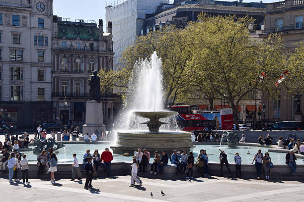 Statues And Fountain Near National Gallery In London, UK The two fountains in Trafalgar Square in London commemorate Admirals Jellycoe and Beatty, and include elaborate sculptures of mermaids, mermen, tritons and dolphins.  The sculptures were created by William McMillan and Sir Charles Wheeler for the fountains designed by Sir Edwin Lutyens in 1935.