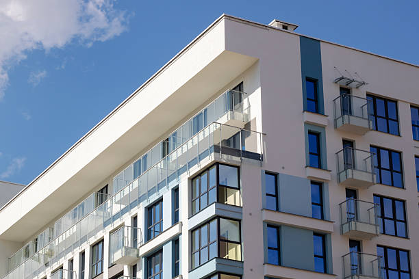 istock Urban design tower block with blue facade, numerous windows, and balconies 2208861214