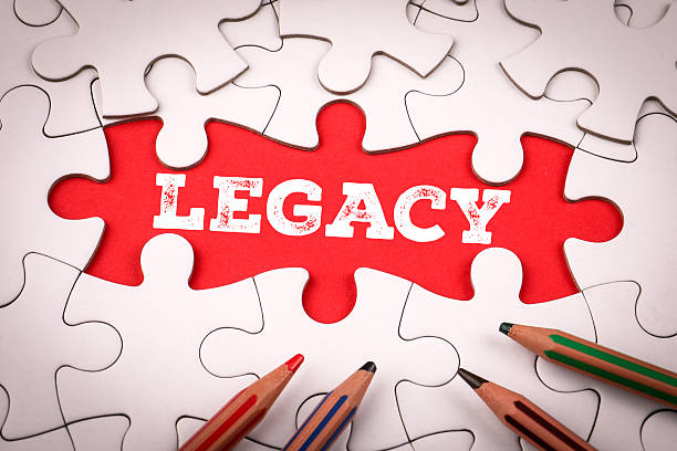 Legacy. White puzzle pieces and colored pencils