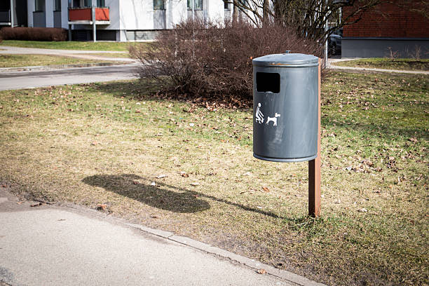 istock Outdoor Trash Bin for Pet Waste with Icon on Grass 2208869254