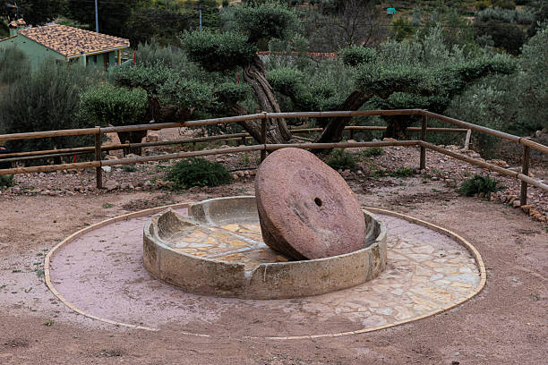istock Traditional Stone Mill: Vertical Water Mill for Grain Grinding 2208872640