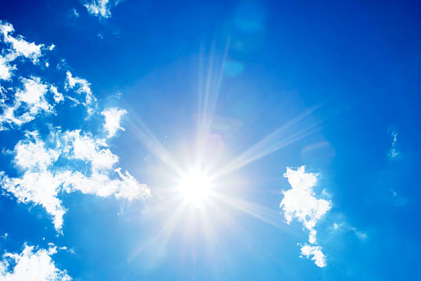 istock Bright sun with beautiful beams on a blue sky 2208873752