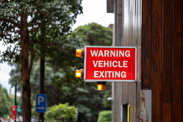 Safety sign at the underground public parking exit in Sydney, Australia.