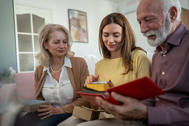 istock Family looking at old photos and remembering good times 2208887356