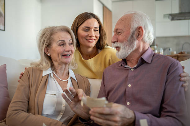istock Happy family sharing old memories at home 2208887421