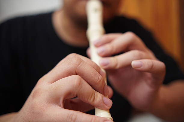 Turkish musician playing the reed flute  with black background and fogs
