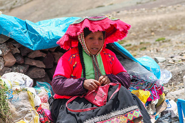 Peruvian traditional craft handmade dolls and textile. Colorful clothes and souvenir dolls Peru dressed in traditional indigenous people women clothes. Different colour vibrant textile Peru craftshop