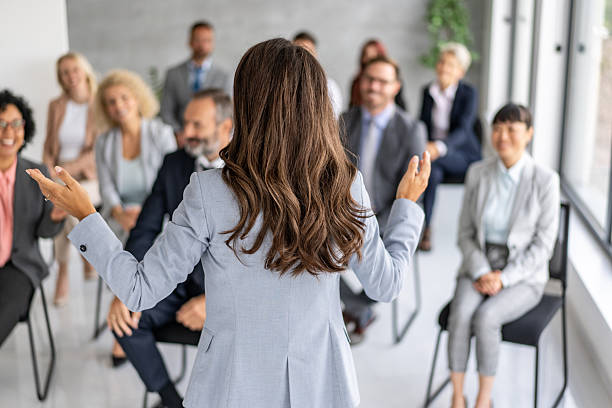 istock Professional Speaker Engaging Attentive Audience in Meeting 2208896671