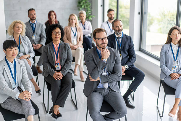 istock Audience reflecting on insights during professional event 2208896680