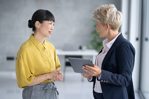 istock Two businesswomen engaging in a professional conversation 2208896734