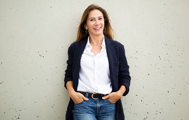 istock confident and approachable woman standing against wall 2208897914