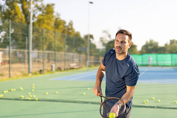 istock Player anticipates opponent's move with poised racket position 2208898620