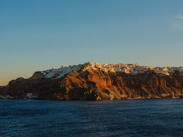 Scenic view of Santorini island from ferry  at sunset