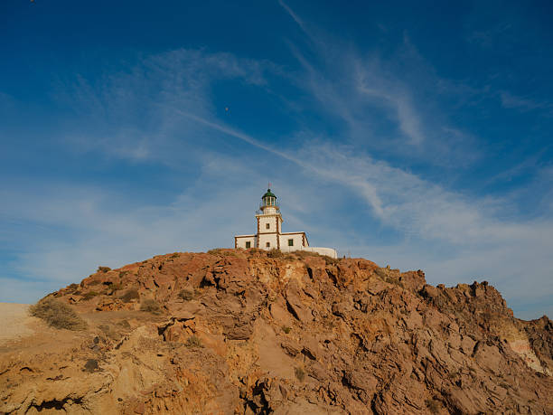 Scenic view of lighthouse on hill on Santorini island in Greece