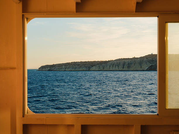 Snnlit interior of ferry between greek islands at sunset, summer vacation island-hopping in Greece