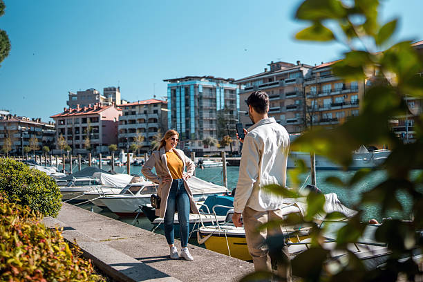 istock Young Caucasian Couple Enjoying Lakeside Walk on a Sunny Day 2208909545