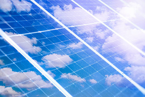 istock Solar panels reflecting the sky with clouds. Environmentally friendly renewable electricity. 2208910691